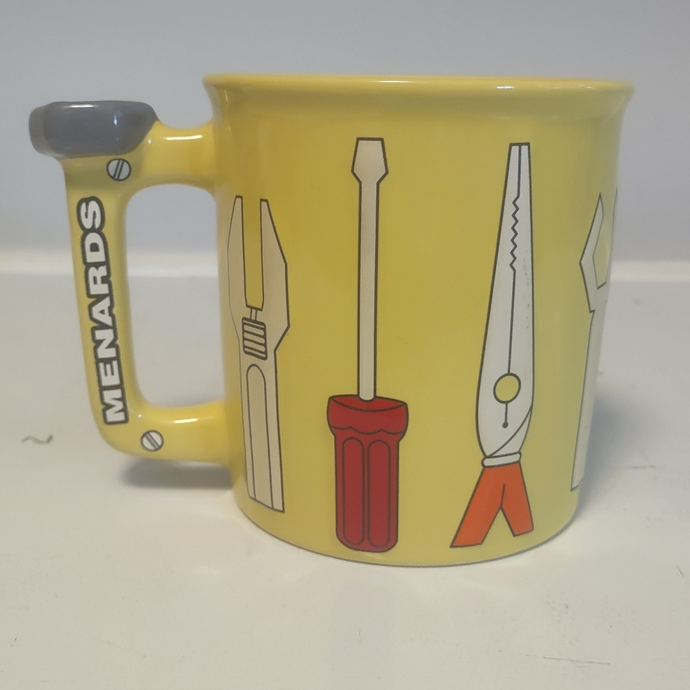 New yellow Menards carpteners mug‎ with tools on it